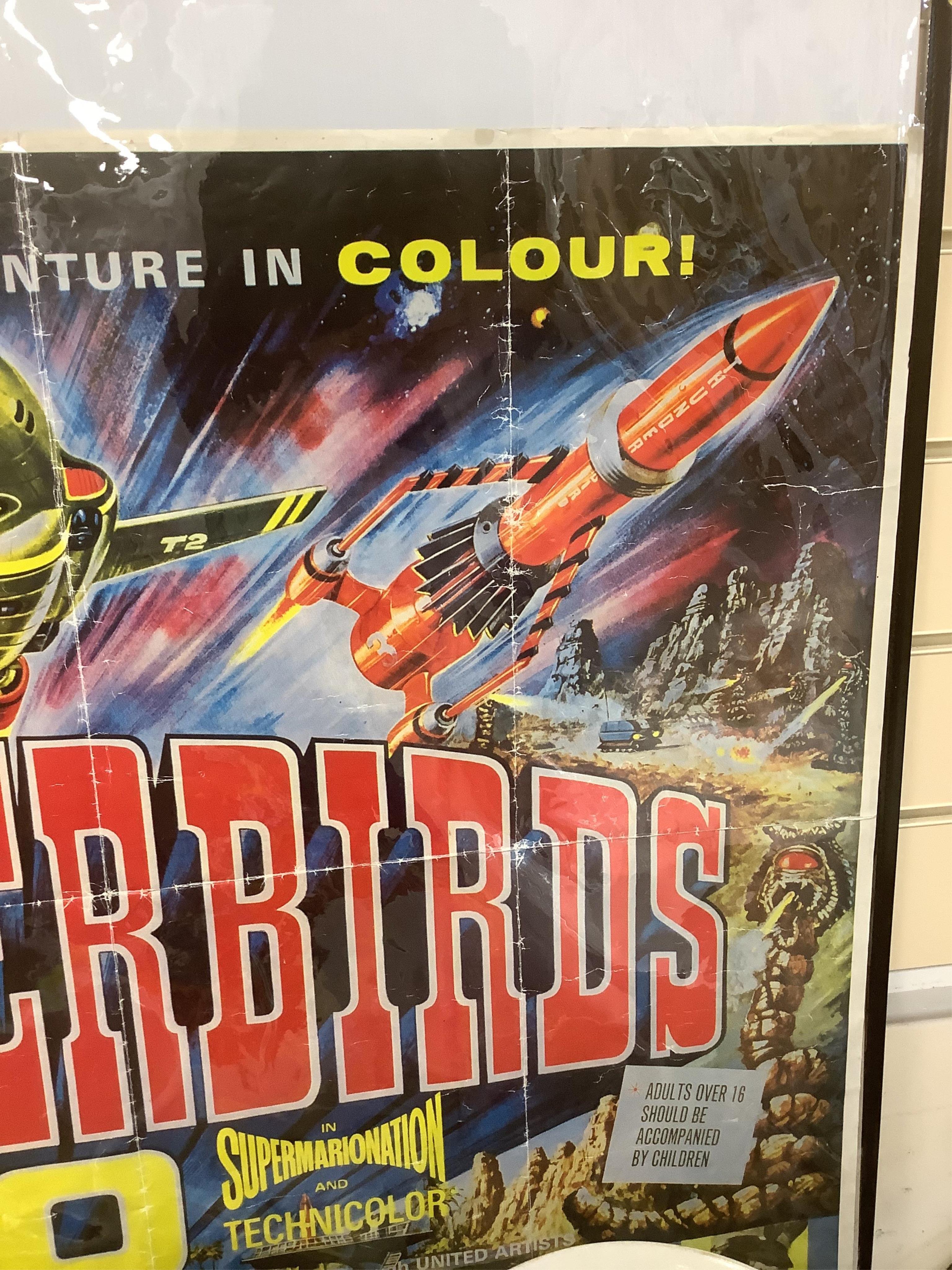 'Thunderbirds Are Go' film poster, a 1980’s reprint, 94cm x 78cm. Condition - fold marks, some small stains along the edges